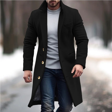 Man wearing a black coat with gold buttons in an outdoor setting
