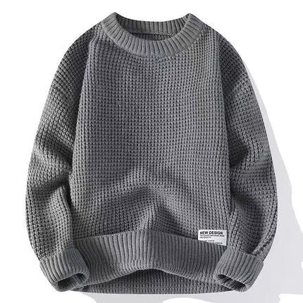 Grey pullover sweater with textured knit design, long sleeves, and casual style.