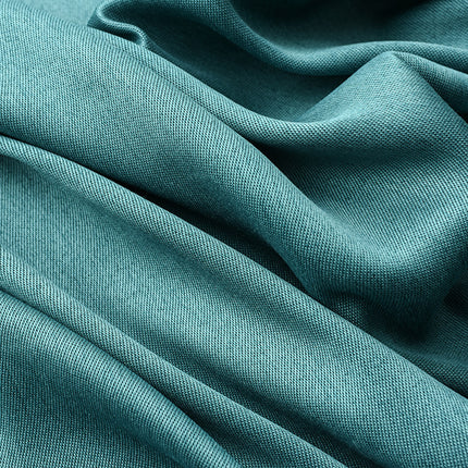 Close-up of teal fabric with folds