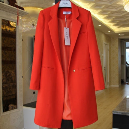 Red coat displayed indoors with a blurred background