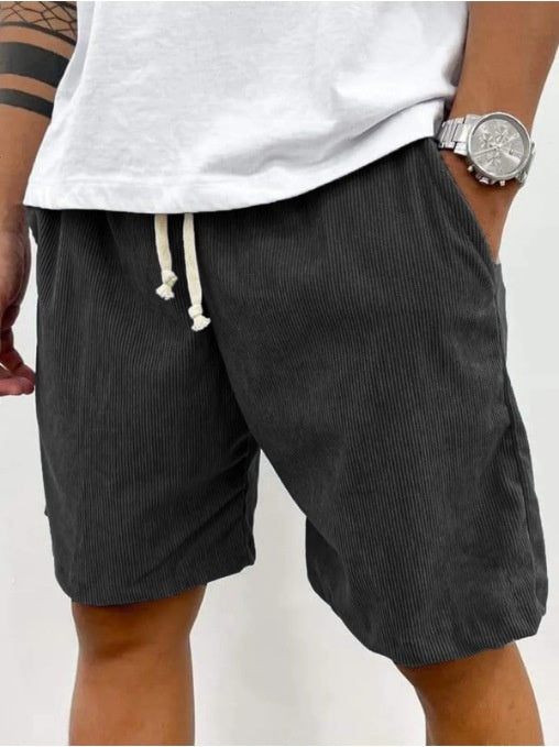 dark gray shorts with a white drawstring 