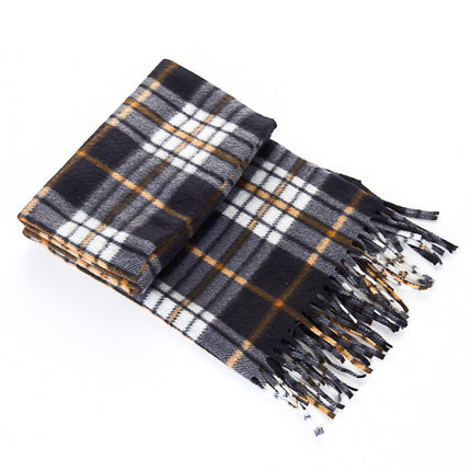 Plaid blanket with fringes on a white background