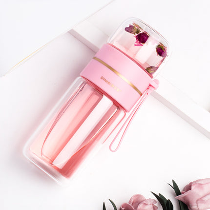 Pink water bottle with floral elements on a white background