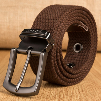 Brown belt with a black buckle on a wooden surface
