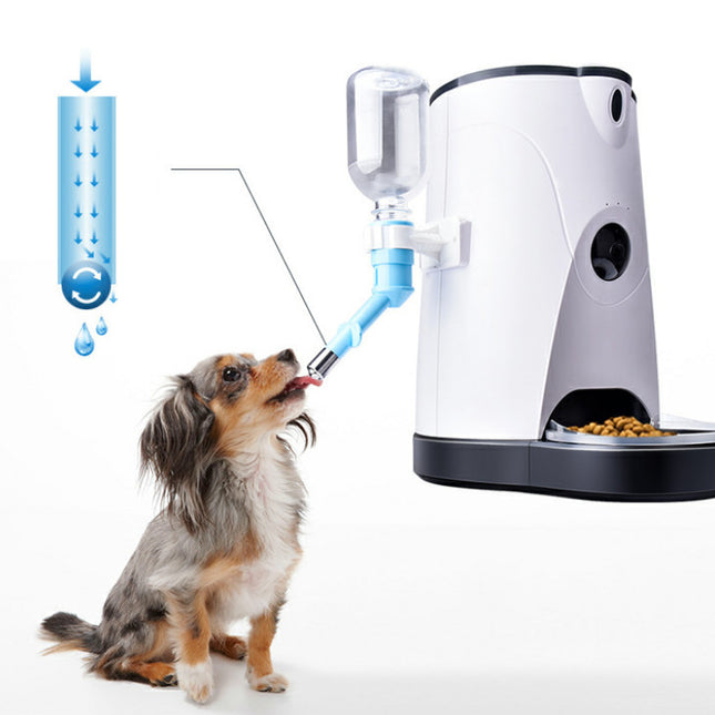 Pet water fountain with a dog drinking from it on a white background