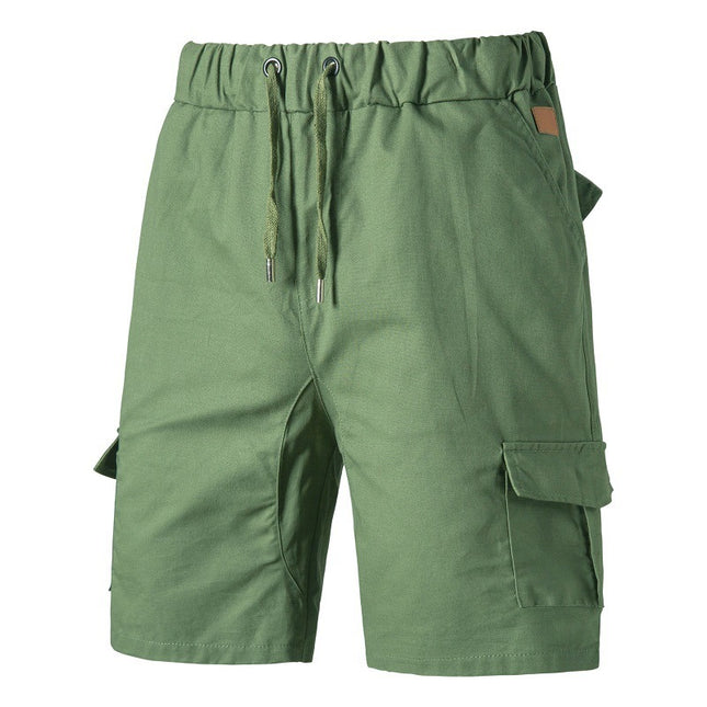 Green cargo shorts with a drawstring on a white background