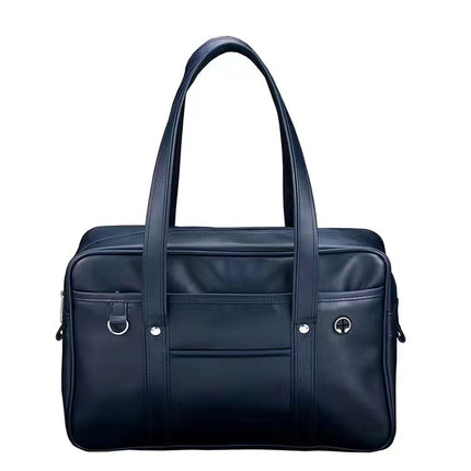 Navy blue handbag with multiple pockets and handles on a white background