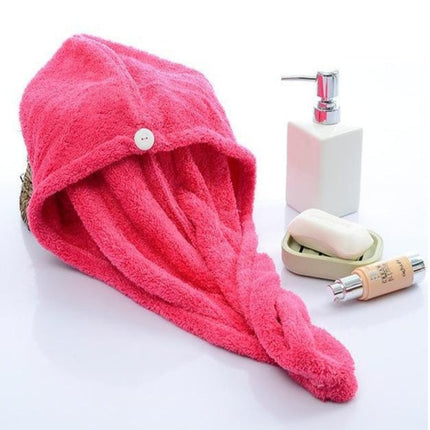 Pink hair towel with soap dish and soap.
