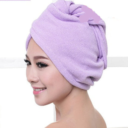 Woman wearing a purple towel wrap.