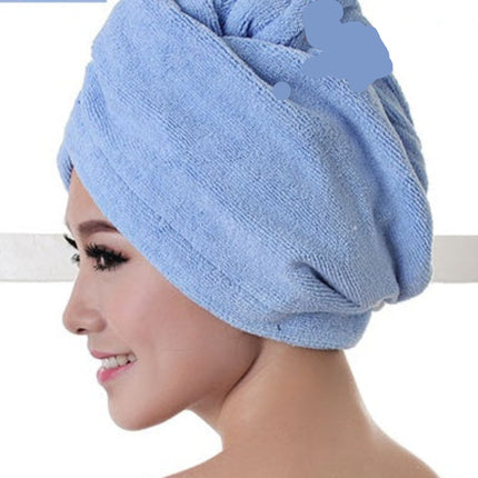 Woman wearing a blue hair towel.