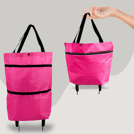 Pink shopping bag with black straps on wheels against a gray background