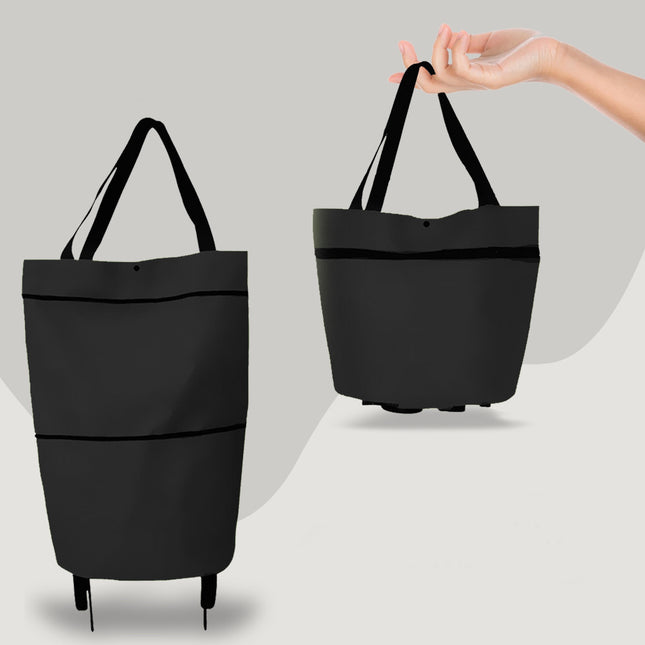 Black tote bag with a hand holding it on a light gray background