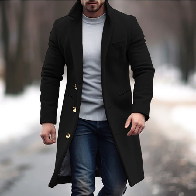 Man wearing a black coat with gold buttons in an outdoor setting