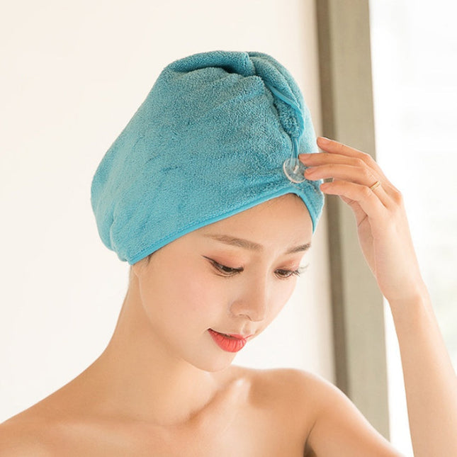Woman wearing a blue hair towel.