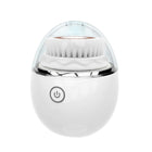 White facial cleansing brush with clear dome cover
