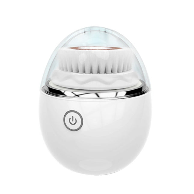 White facial cleansing brush with clear dome cover