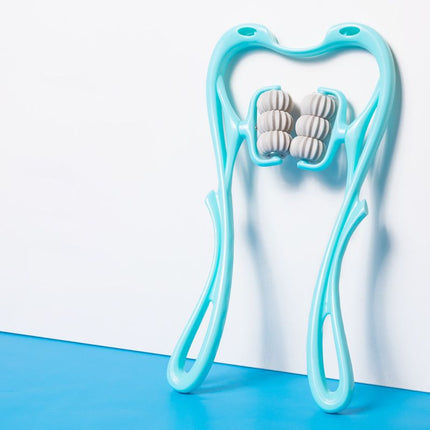 Light blue facial roller with white massage stones on a white background