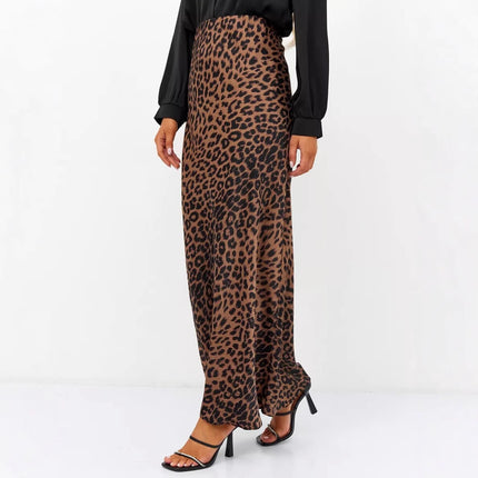 Leopard print pants worn by a person on a white background