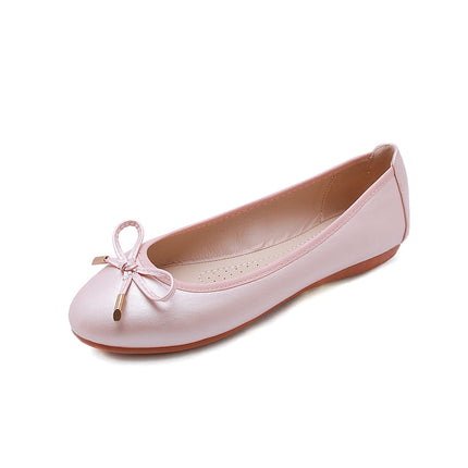 Pink foldable ballet shoes with bow detail, soft bottom, and flat heel, ideal for casual wear.