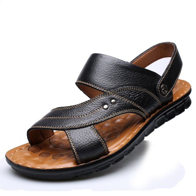 Black leather sandal with brown sole on a white background