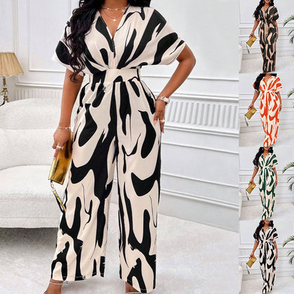Woman wearing a black and white patterned dress in an indoor setting.
