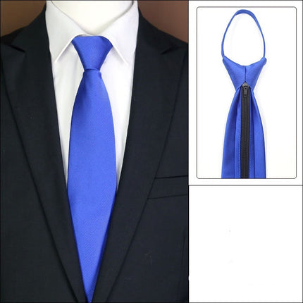 Blue tie with a zipper on a mannequin wearing a suit, with close-up inset of the tie.