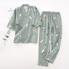 Green pajama set with dog pattern on a white background