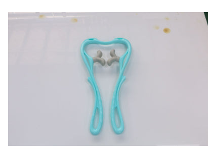 Blue hair tie on a white background