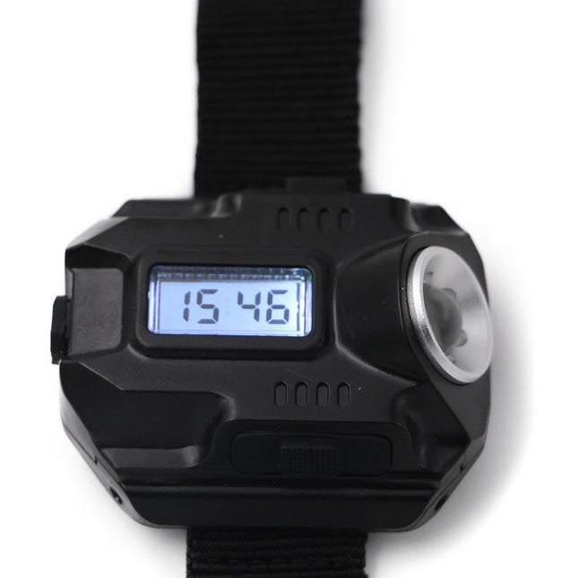 Black electronic device with digital display and flashlight on a white background