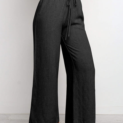 Dark gray wide-leg pants with a tie waist on a white background
