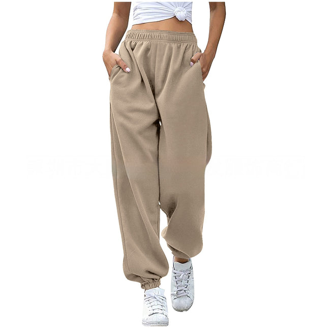 Beige sweatpants worn by a person on a white background