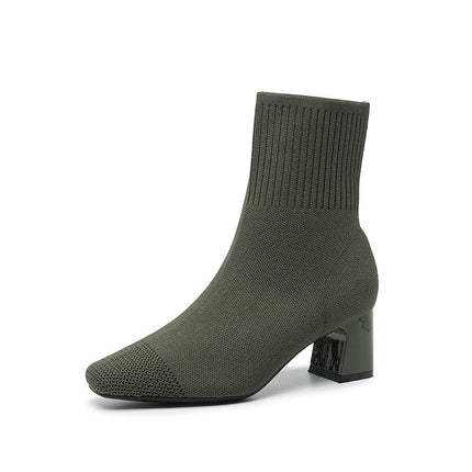 Green sock boot on a white background