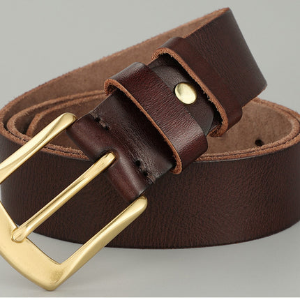 Brown leather belt with a gold buckle on a gray background