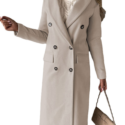 Woman wearing a beige coat holding a matching handbag on a white background
