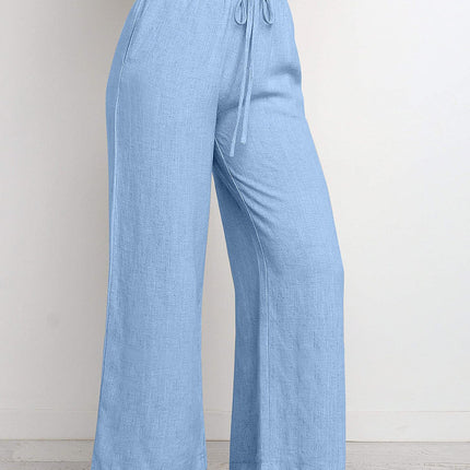 Light blue wide-leg pants with a tie waist on a plain background
