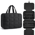 Black travel organizer with a quilted design on a white background