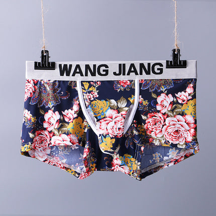 Floral-patterned underwear hanging on a stand with 'WANG JIANG' branding.