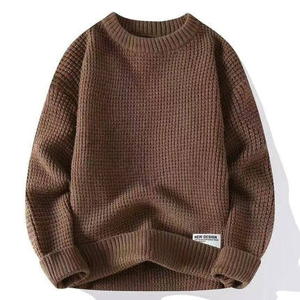 Brown loose pullover sweater with ribbed texture and label, suitable for autumn and winter fashion.