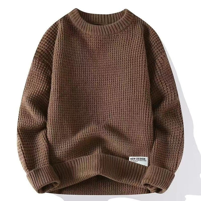 Brown loose pullover sweater with ribbed texture and label, suitable for autumn and winter fashion.