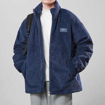 Person wearing a blue corduroy jacket
