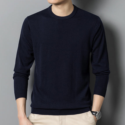Person wearing a blue long-sleeve shirt against a gray background