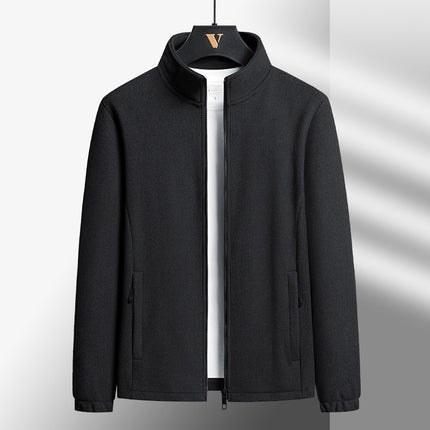 Black jacket on a hanger against a gray background