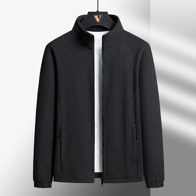 Black jacket on a hanger against a gray background
