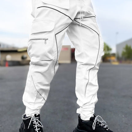 White cargo pants with black sneakers on a blurred outdoor background