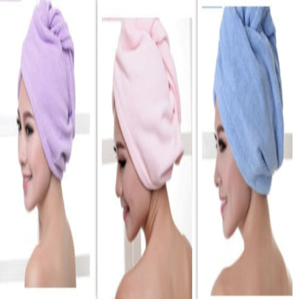 Three women wearing purple, pink, and blue towel turbans.