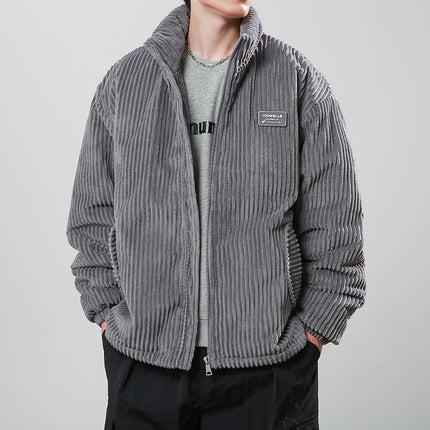 Person wearing a gray corduroy jacket