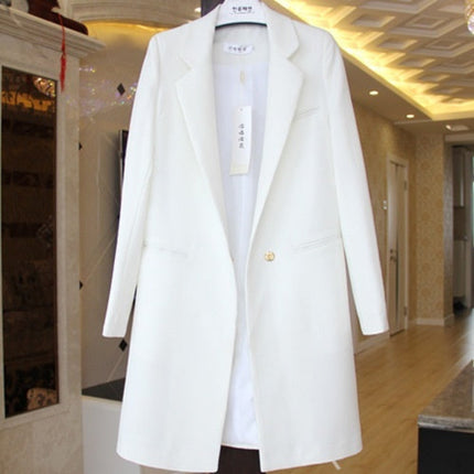 White coat displayed in a room with a mirror and hallway in the background
