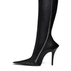 Black leather knee-high boot with a high heel on a white background