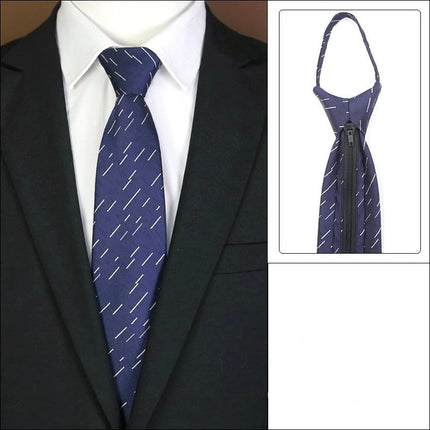Navy blue tie with white pattern worn by a person in a suit, with an inset showing the tie as a zip-up design.