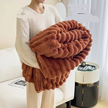 Person holding a brown plush blanket